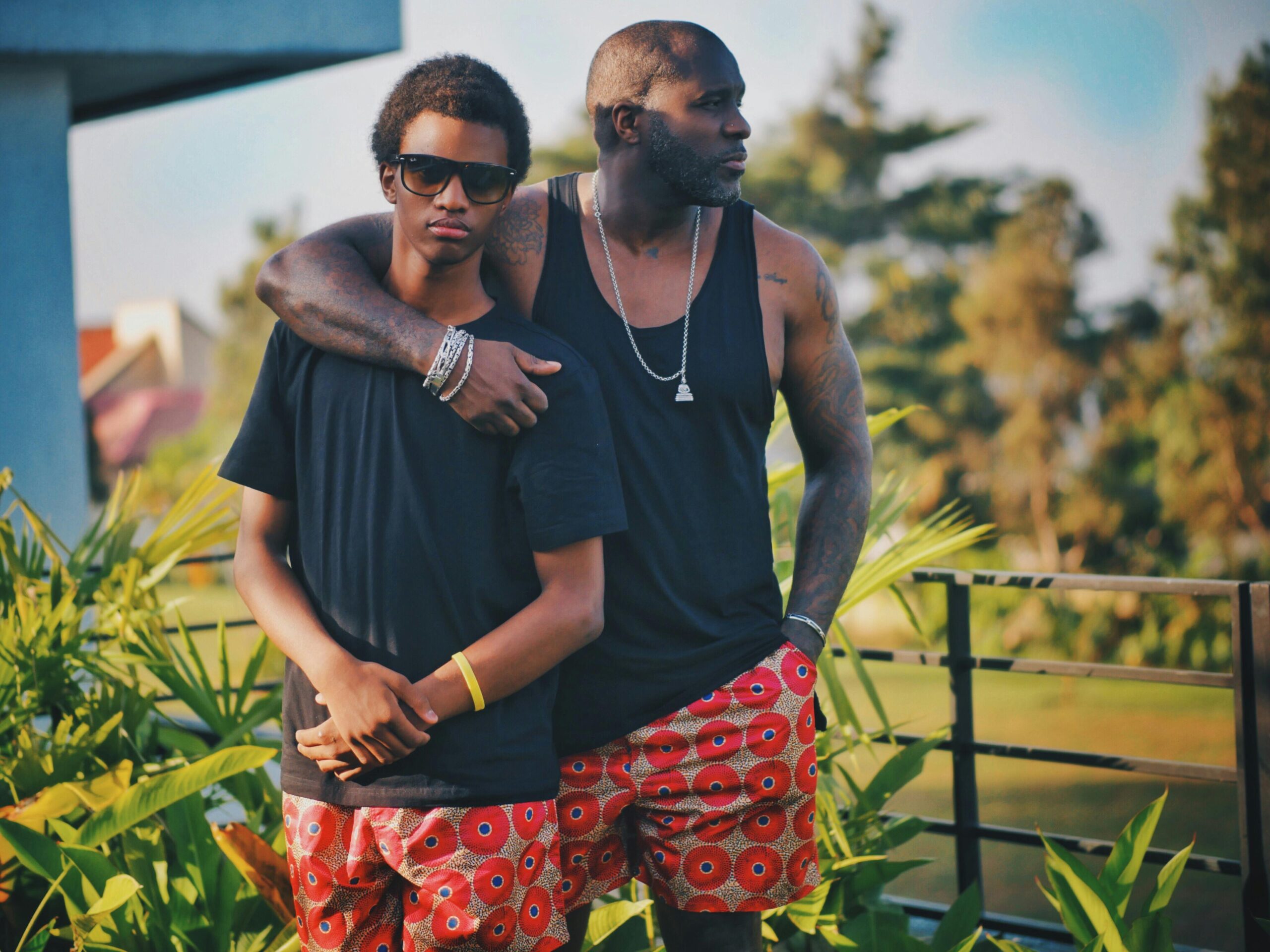 A warm father-son moment captured outdoors in Kinshasa, showcasing love and togetherness.